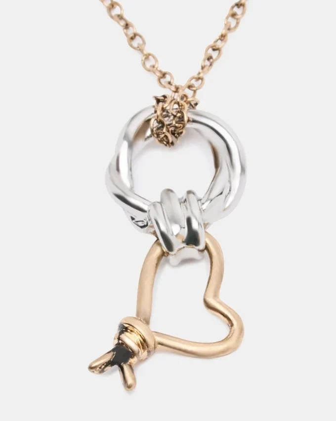 Collar con colgante de corazón con nudo en dos tonos Collar con colgante de corazón con nudo en dos tonos