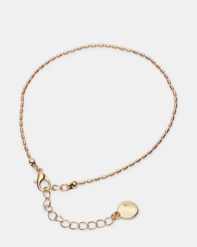 Conjunto de tobilleras con cadena en espiga dorada Conjunto de tobilleras con cadena en espiga dorada
