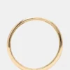 Pulsera tipo brazalete fino dorada