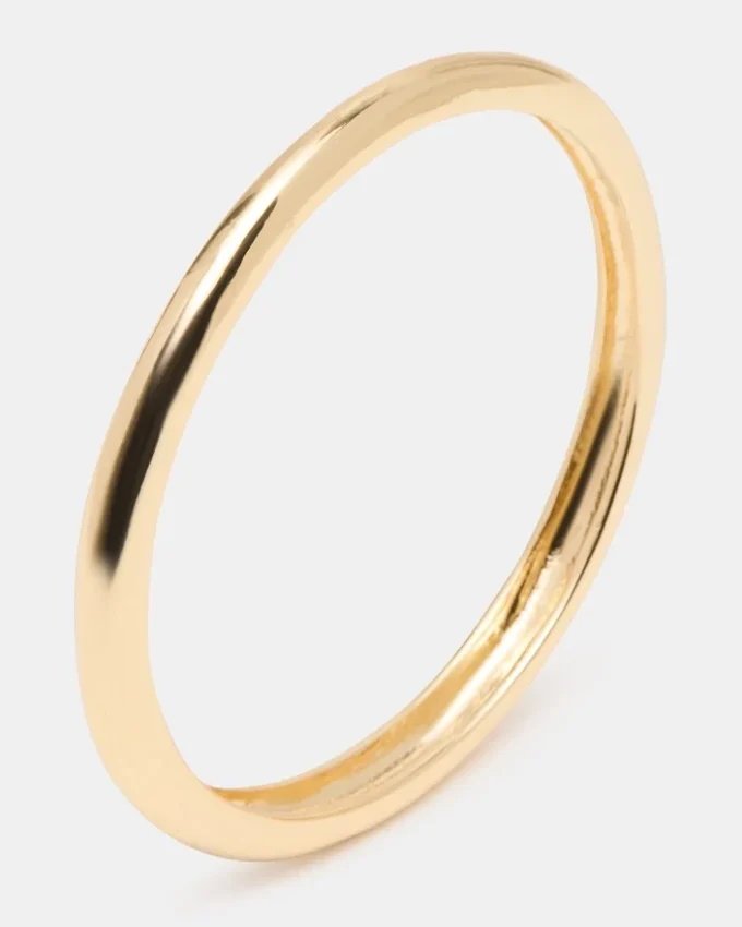 Pulsera tipo brazalete fino dorada