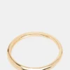 Pulsera tipo brazalete fino dorada