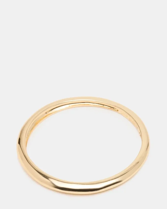 Pulsera tipo brazalete fino dorada
